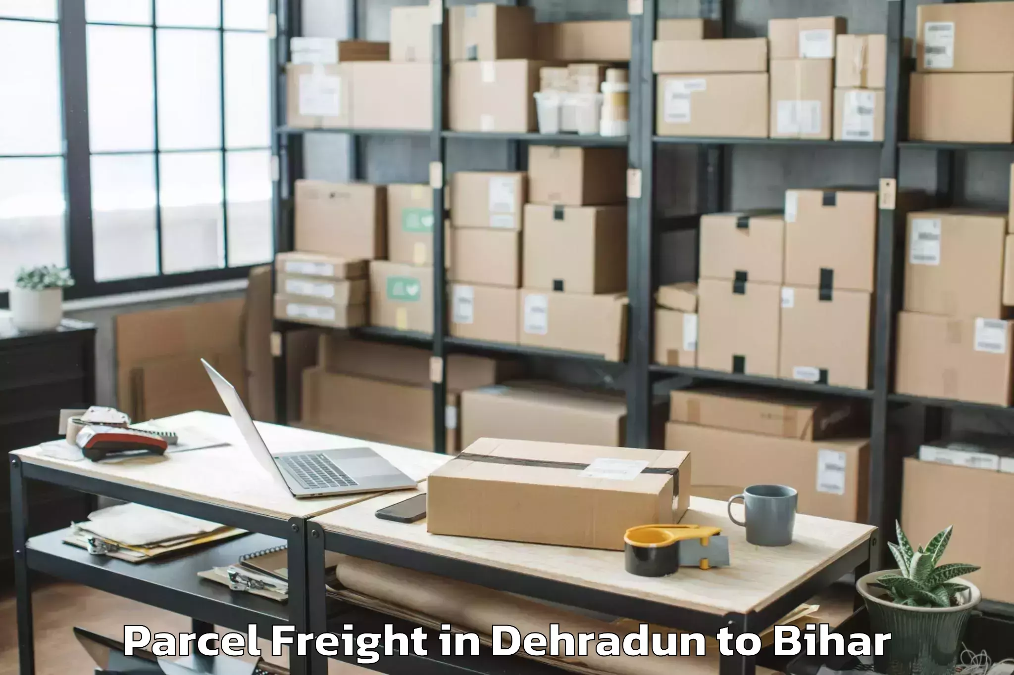 Book Dehradun to Majhaulia Parcel Freight Online